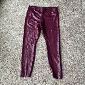 Brand new without tags Womens Nike leggings size large. Maroon/glitter red
